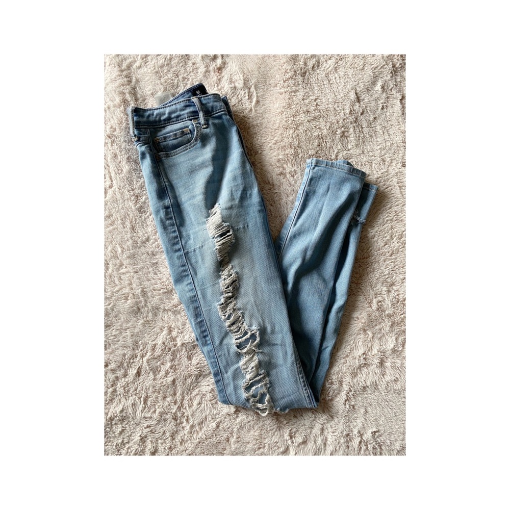 Hollister: Blue, Ripped jeans.